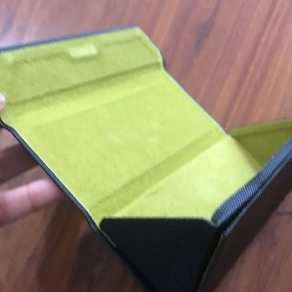 Nicole Miller Black hard triangular eyeglass case.